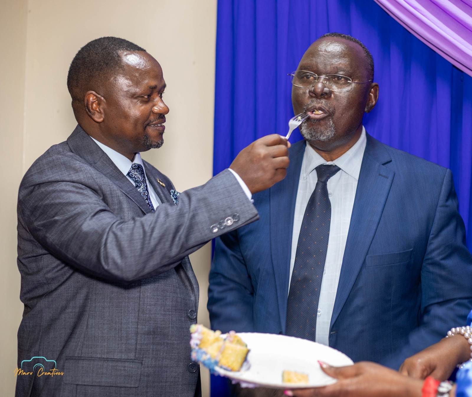 Guests sharing a launch cake at a Chance Publishers event